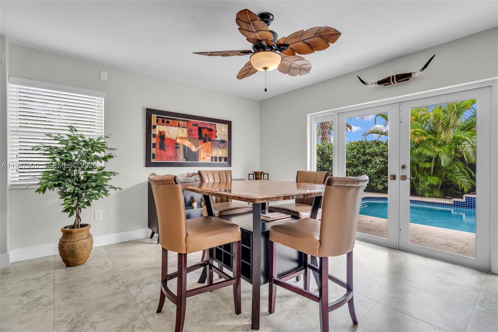 15726 Southwest 76th Terrace Miami, FL 33193 - Photo 14 of 34 a view of a dining room with furniture window and outside view