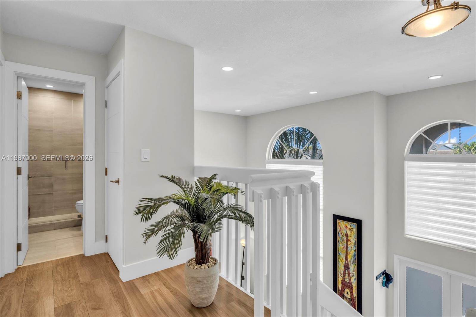 15726 Southwest 76th Terrace Miami, FL 33193 - Photo 20 of 34 a view of a hallway with wooden floor and glass door