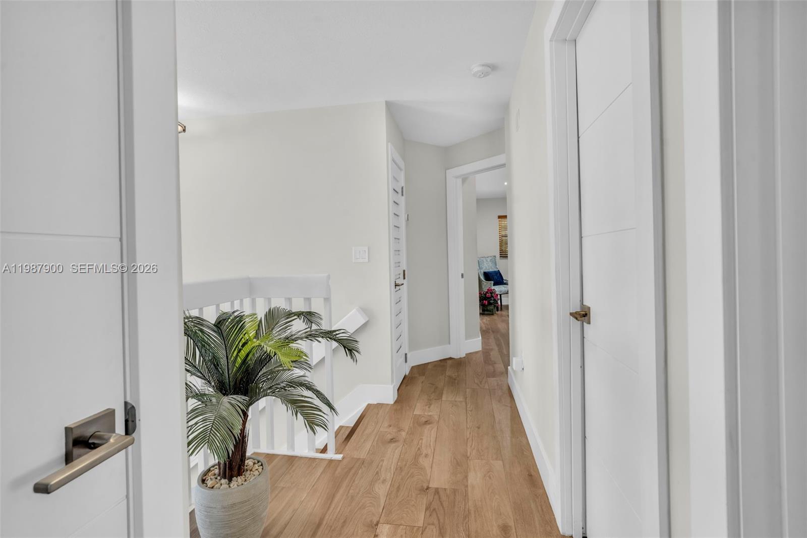 15726 Southwest 76th Terrace Miami, FL 33193 - Photo 21 of 34 a view of a hallway with potted plants