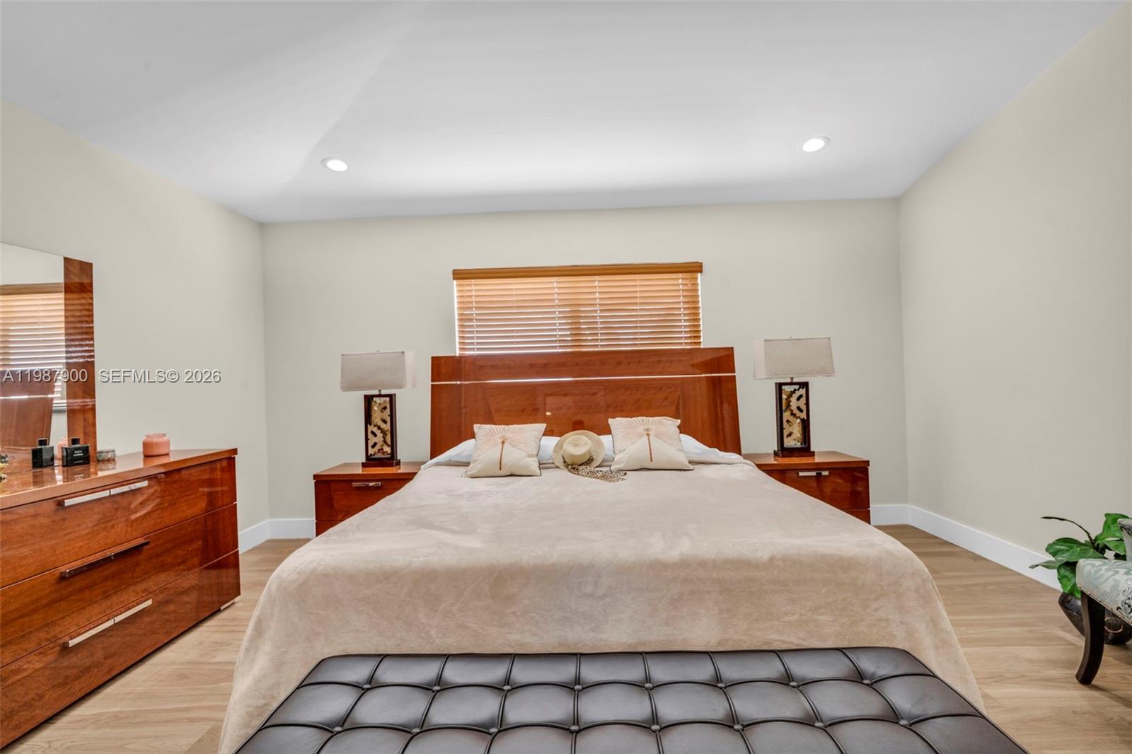 15726 Southwest 76th Terrace Miami, FL 33193 - Photo 23 of 34 a bedroom with a bed and a dresser