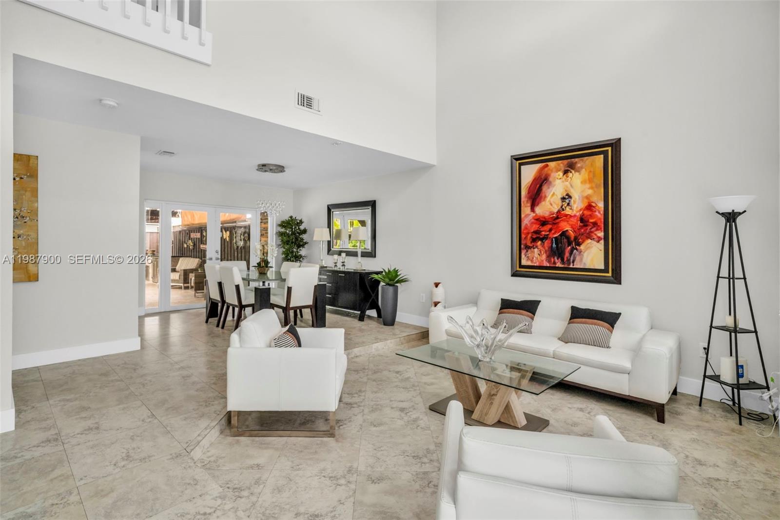 15726 Southwest 76th Terrace Miami, FL 33193 - Photo 5 of 34 a living room with furniture and a table