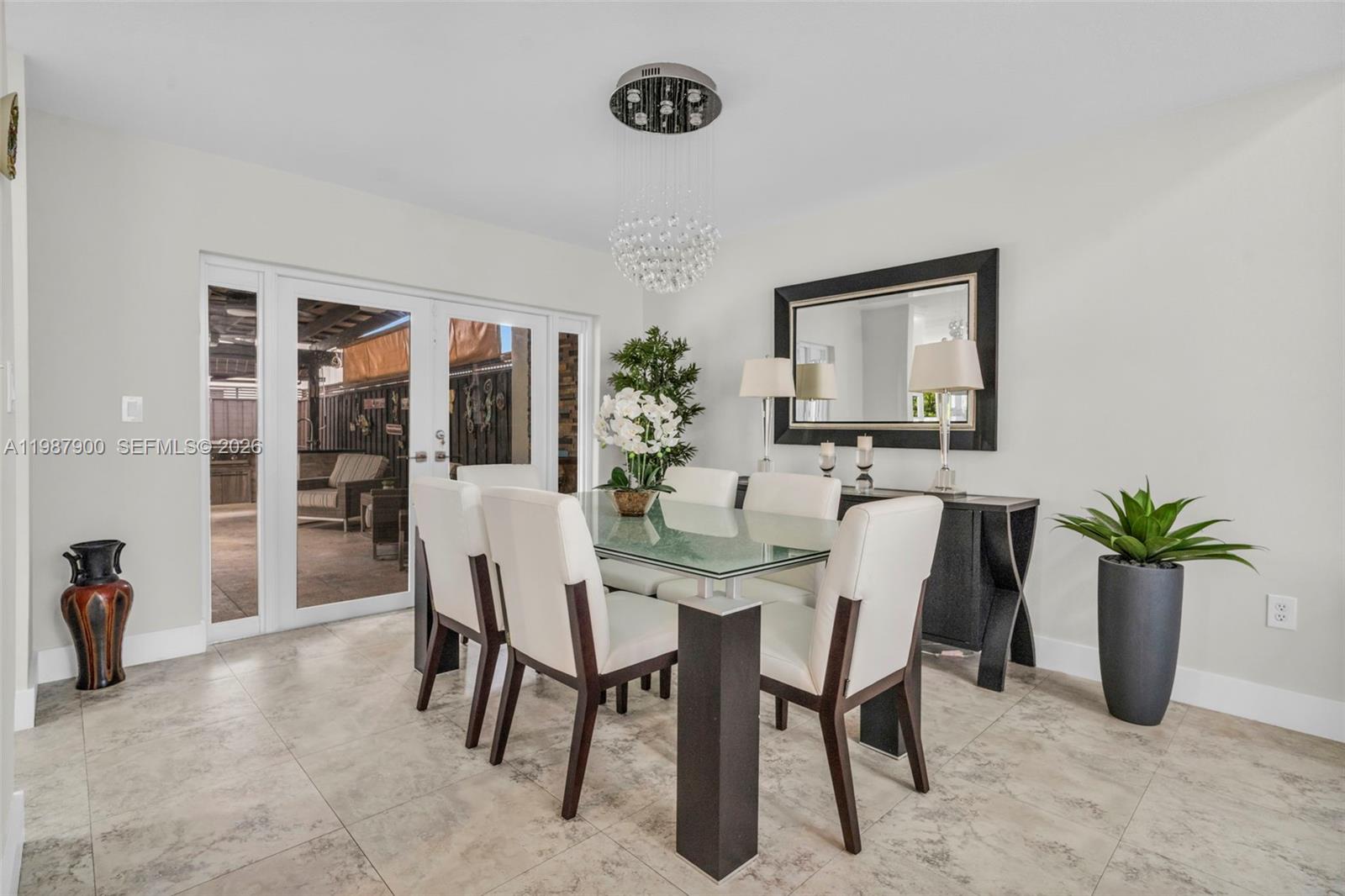 15726 Southwest 76th Terrace Miami, FL 33193 - Photo 8 of 34 a dining room with furniture and window