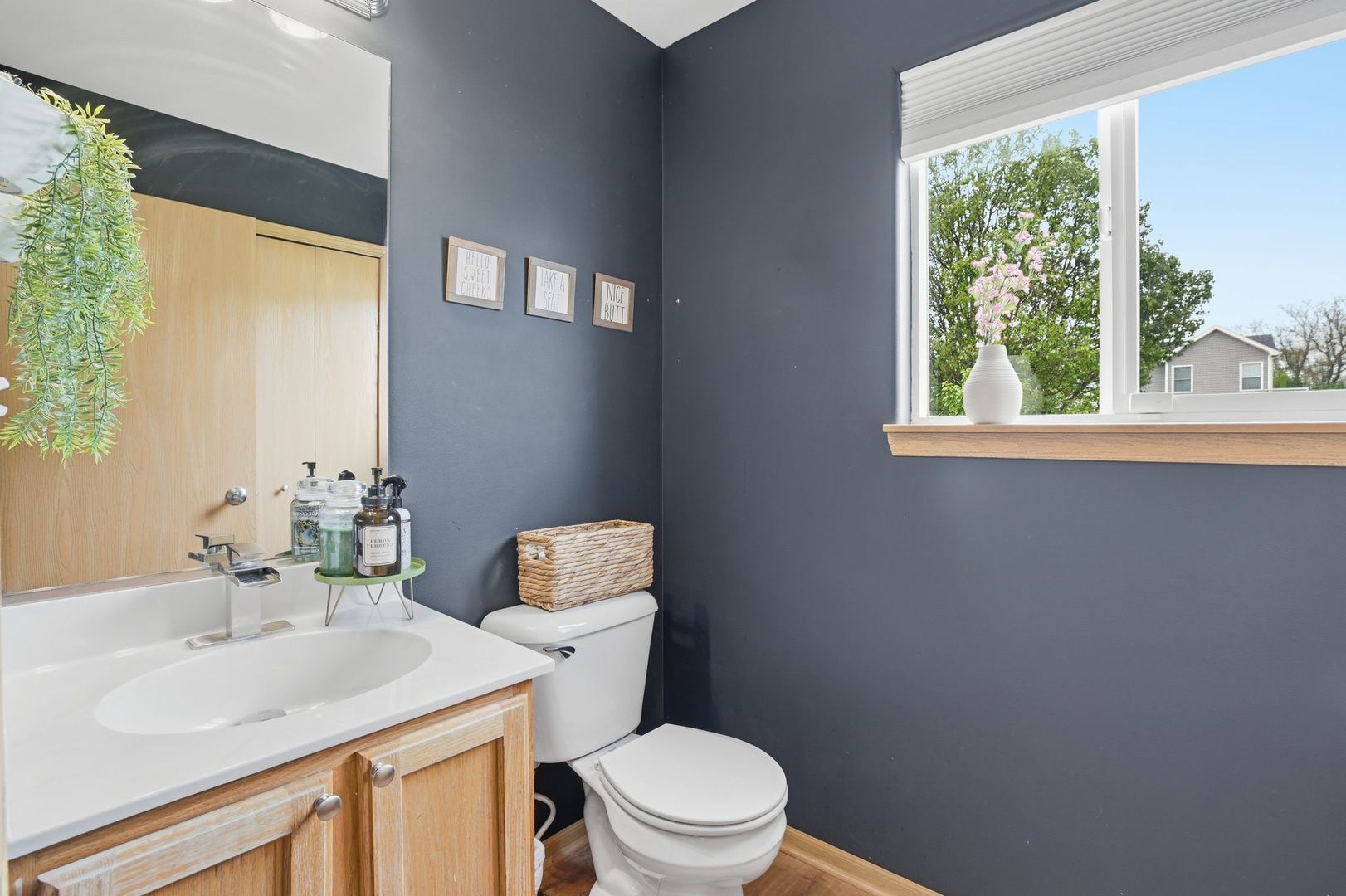 797 Kyle Court Braidwood, IL 60408 - Photo 11 of 33 a bathroom with a sink a toilet and a window
