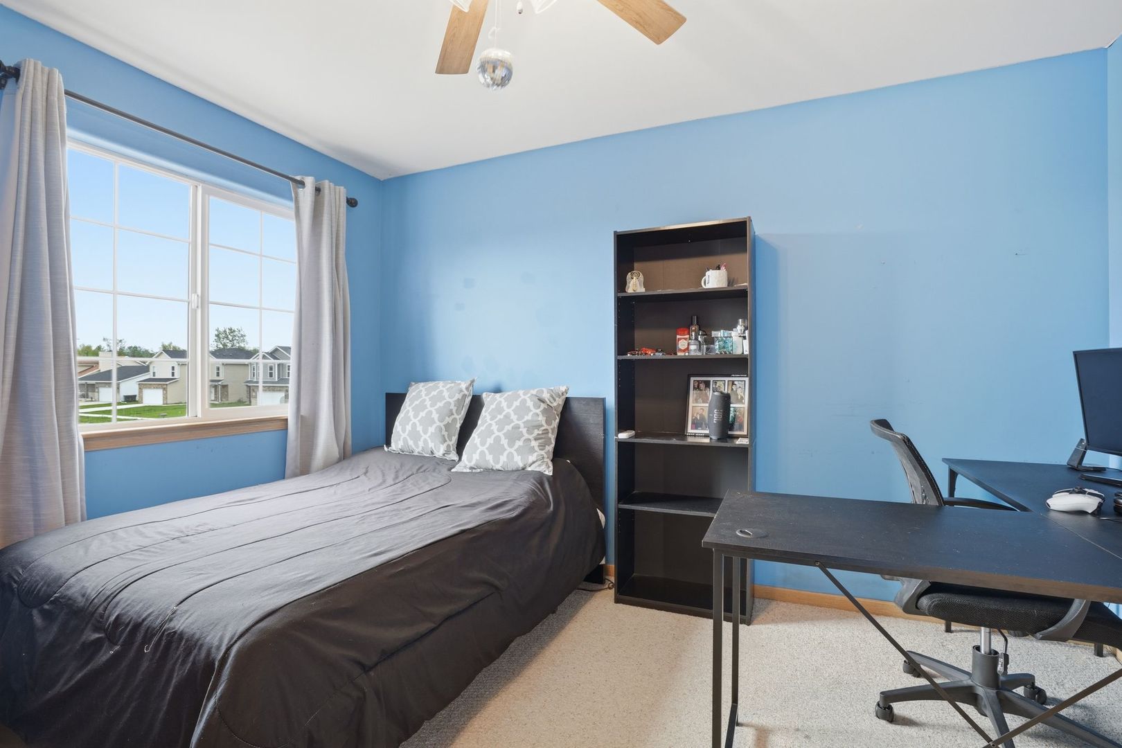 797 Kyle Court Braidwood, IL 60408 - Photo 16 of 33 a bedroom with a bed and a desk