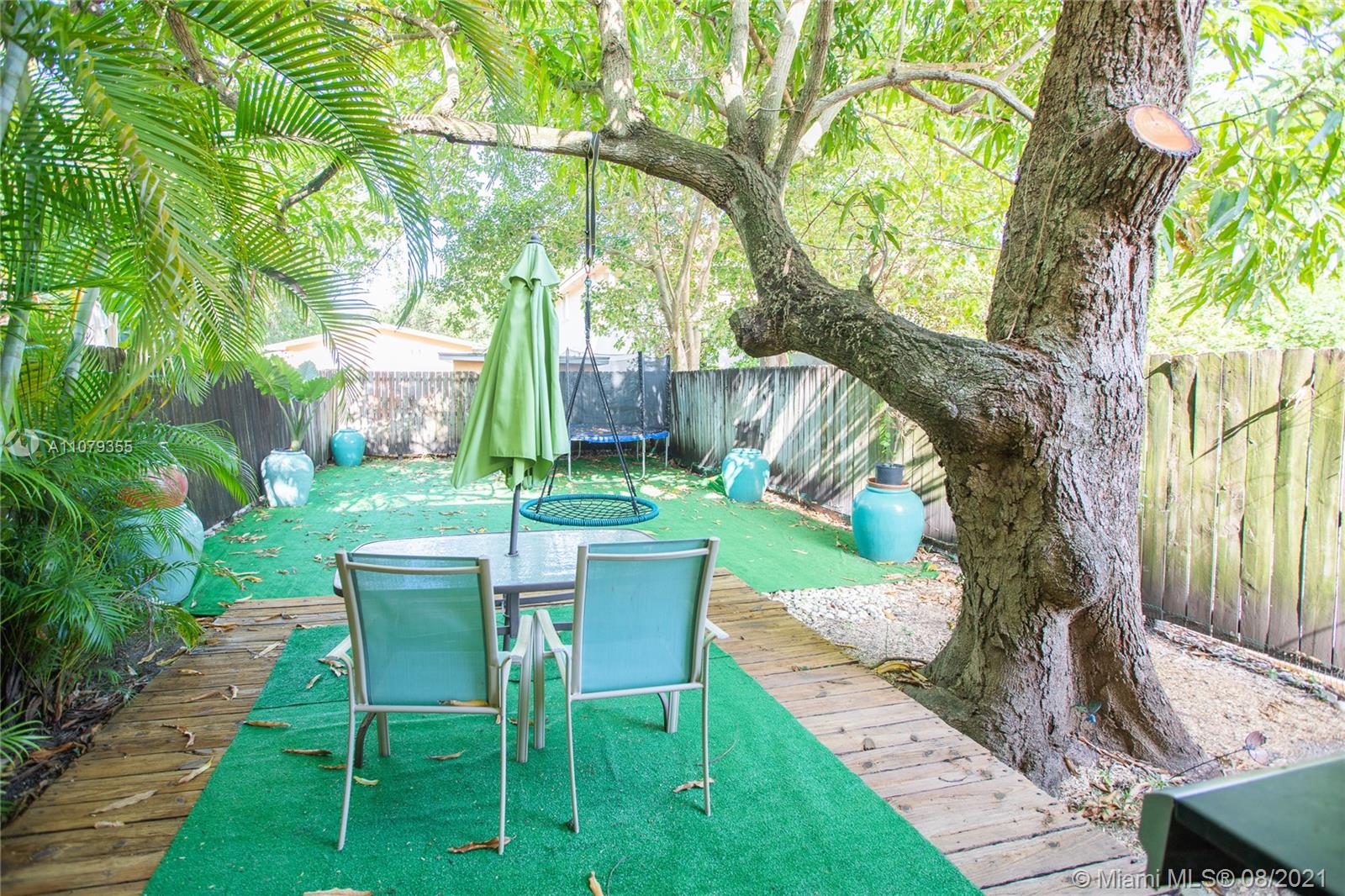 3053 Elizabeth Street, Unit 3053 Miami, FL 33133 - Photo 2 of 42 a view of yard with furniture and a garden