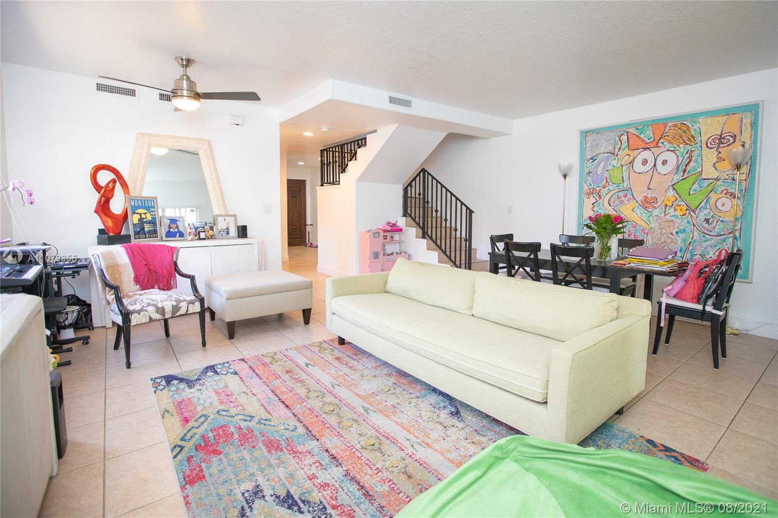 3053 Elizabeth Street, Unit 3053 Miami, FL 33133 - Photo 12 of 42 a living room with furniture and a rug