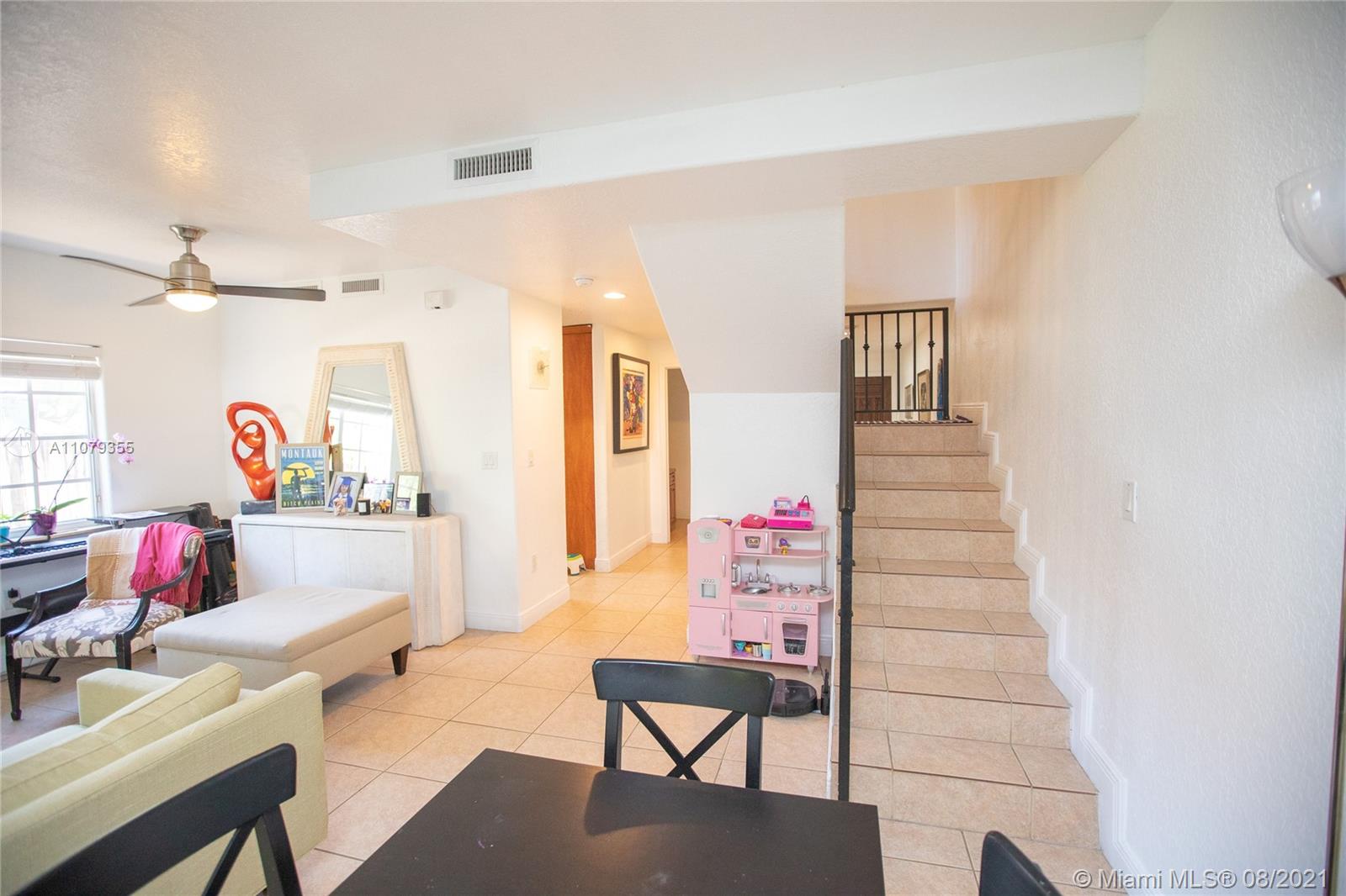 3053 Elizabeth Street, Unit 3053 Miami, FL 33133 - Photo 14 of 42 a bedroom with furniture and a wooden floor