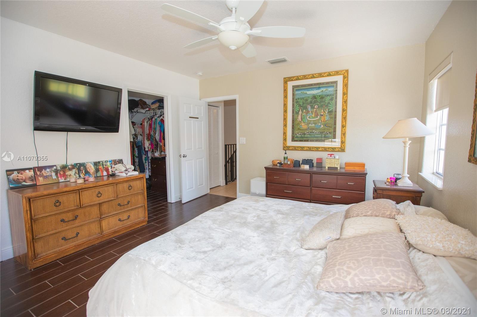 3053 Elizabeth Street, Unit 3053 Miami, FL 33133 - Photo 19 of 42 a bedroom with a bed and a flat screen tv