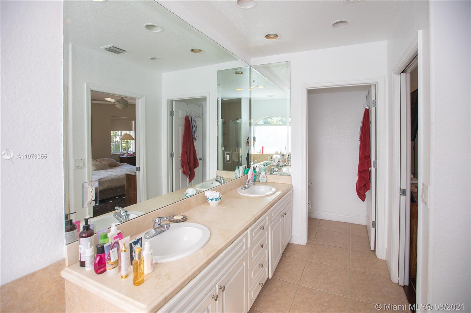 3053 Elizabeth Street, Unit 3053 Miami, FL 33133 - Photo 21 of 42 a bathroom with a tub sink and mirror