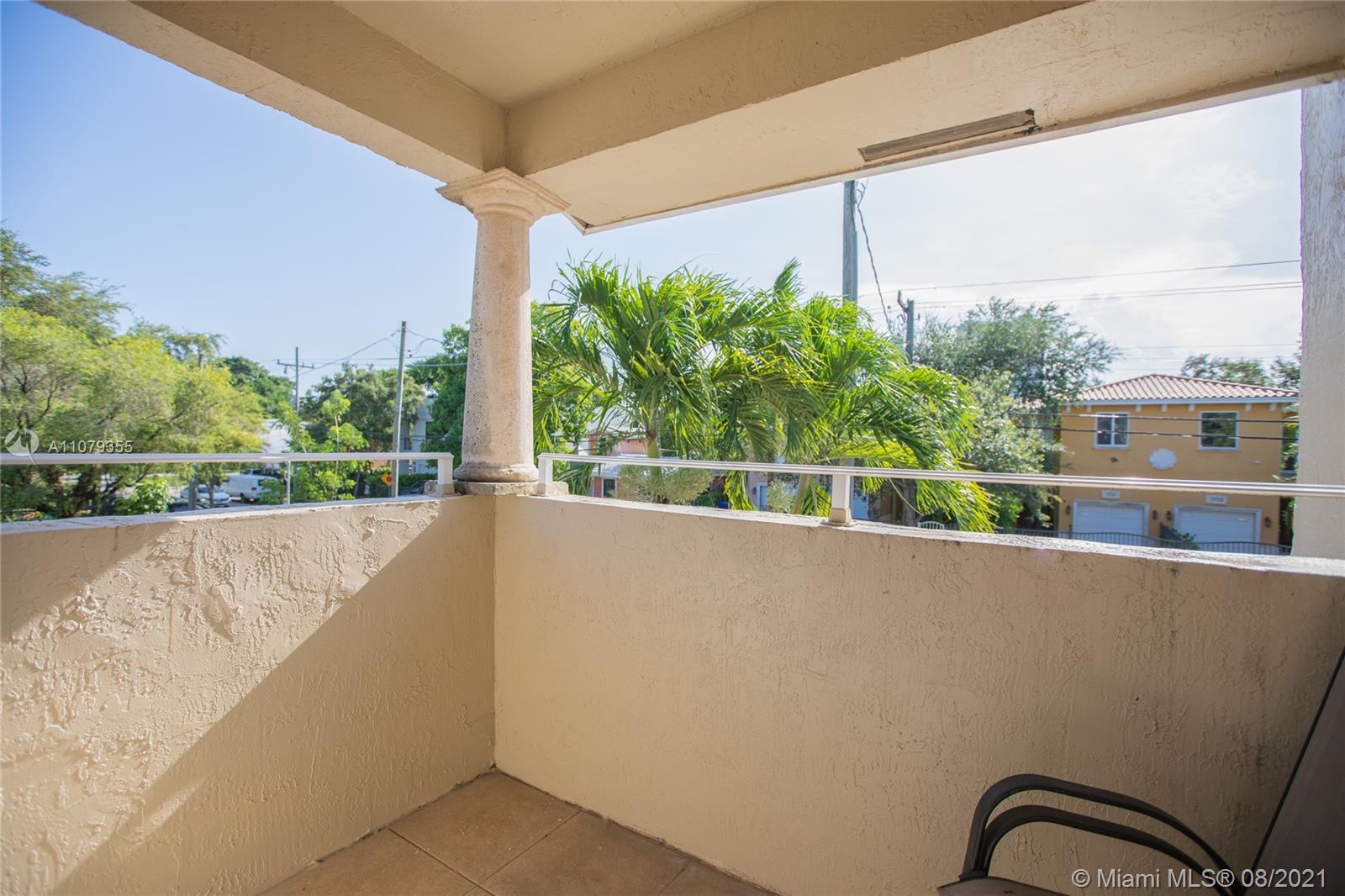 3053 Elizabeth Street, Unit 3053 Miami, FL 33133 - Photo 22 of 42 a view of a building from a balcony