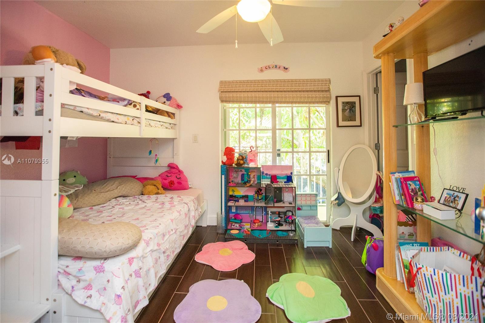 3053 Elizabeth Street, Unit 3053 Miami, FL 33133 - Photo 23 of 42 a bedroom with a bed closet and a window