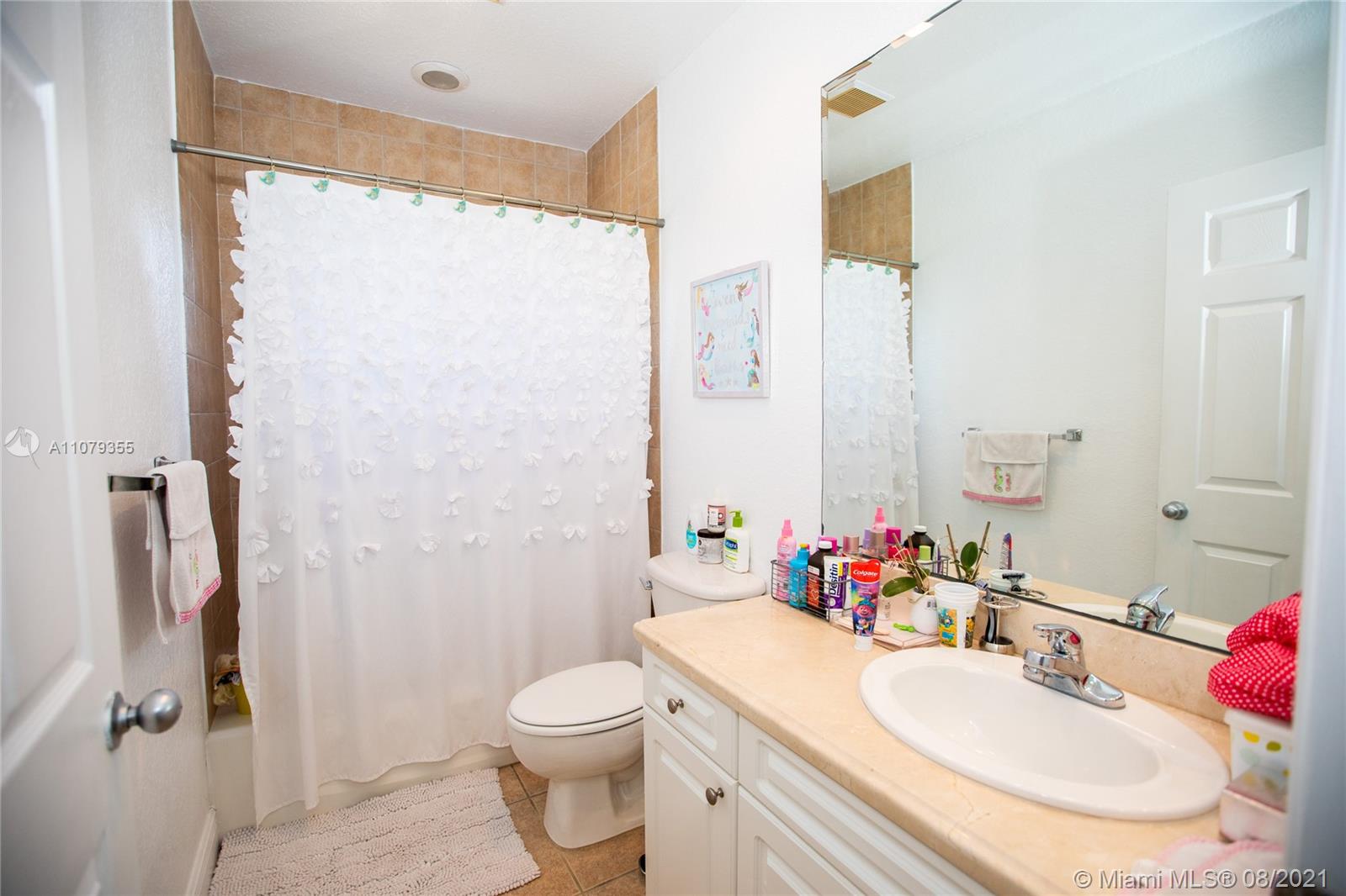 3053 Elizabeth Street, Unit 3053 Miami, FL 33133 - Photo 25 of 42 a bathroom with a sink toilet and shower