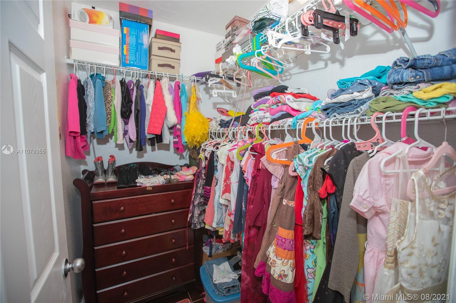 3053 Elizabeth Street, Unit 3053 Miami, FL 33133 - Photo 26 of 42 a view of walk in closet with clothes