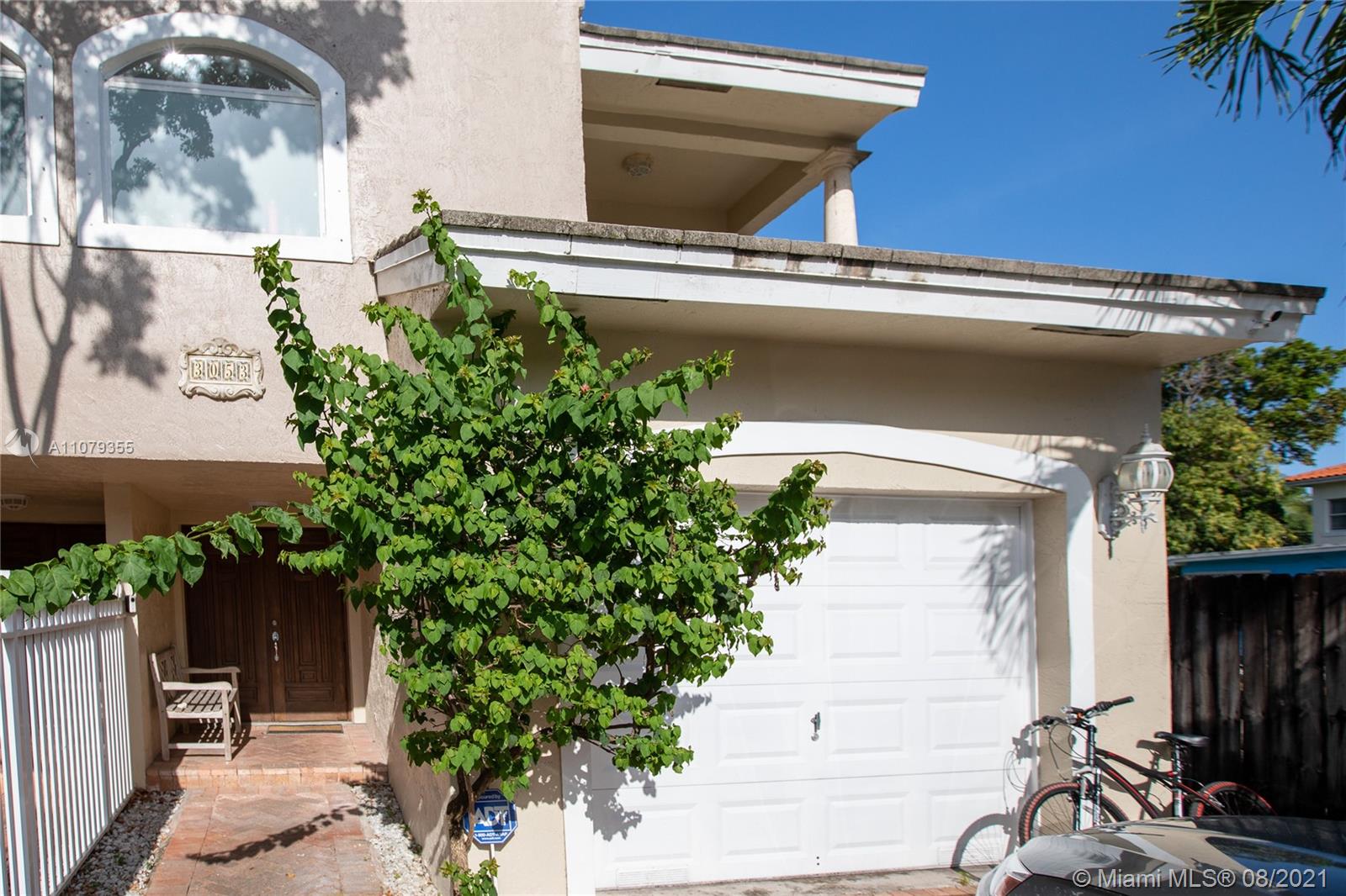 3053 Elizabeth Street, Unit 3053 Miami, FL 33133 - Photo 4 of 42 a view of front door and potted plants
