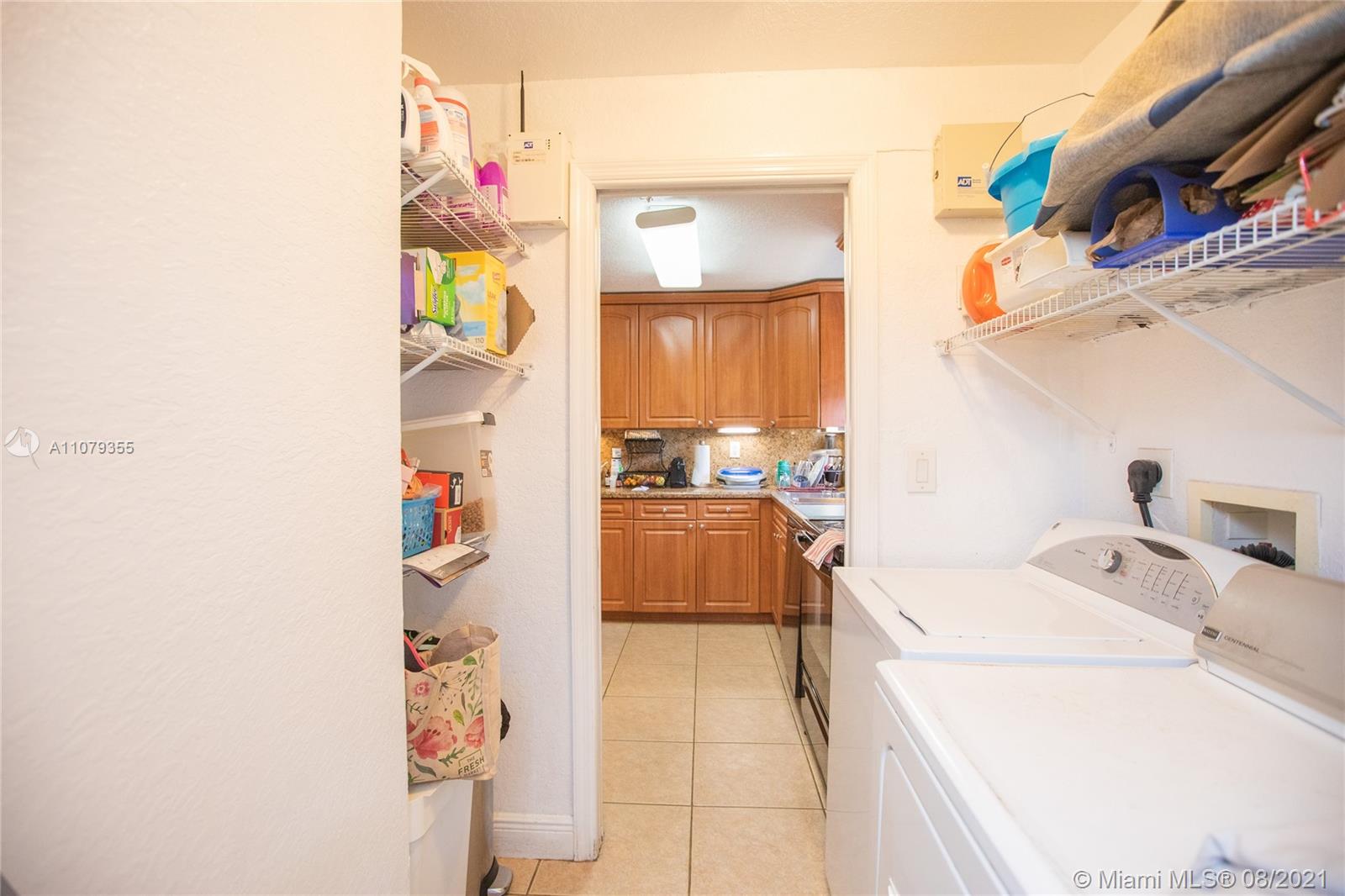 3053 Elizabeth Street, Unit 3053 Miami, FL 33133 - Photo 31 of 42 a bathroom with a sink a bath tub and a shower curtain