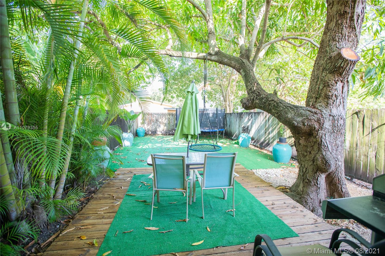 3053 Elizabeth Street, Unit 3053 Miami, FL 33133 - Photo 32 of 42 a view of a table and chairs in patio