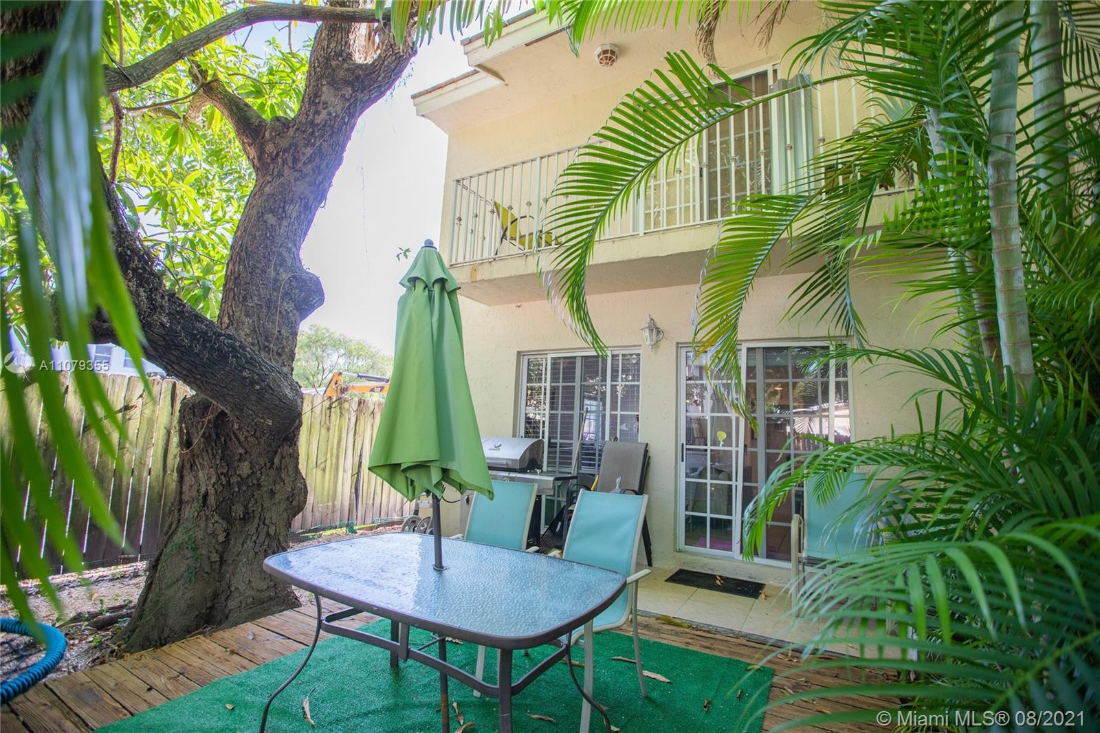 3053 Elizabeth Street, Unit 3053 Miami, FL 33133 - Photo 36 of 42 a view of a chairs and table in patio