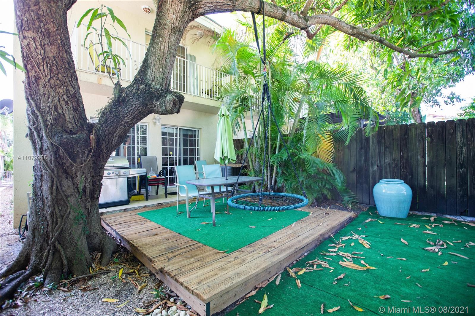 3053 Elizabeth Street, Unit 3053 Miami, FL 33133 - Photo 39 of 42 a view of a house with backyard and sitting area