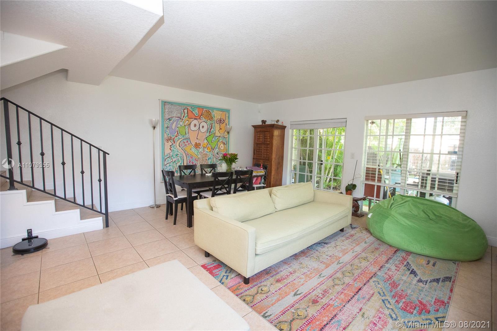 3053 Elizabeth Street, Unit 3053 Miami, FL 33133 - Photo 10 of 42 a living room with furniture and a large window