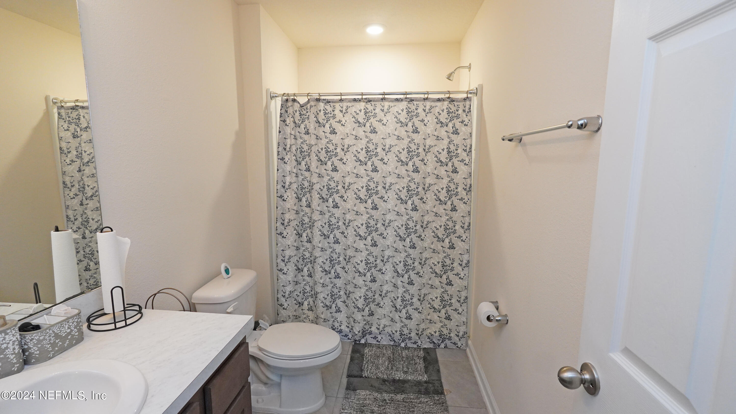 86760 Mainline Road Yulee, FL 32097 - Photo 12 of 17 a bathroom with a sink toilet and shower