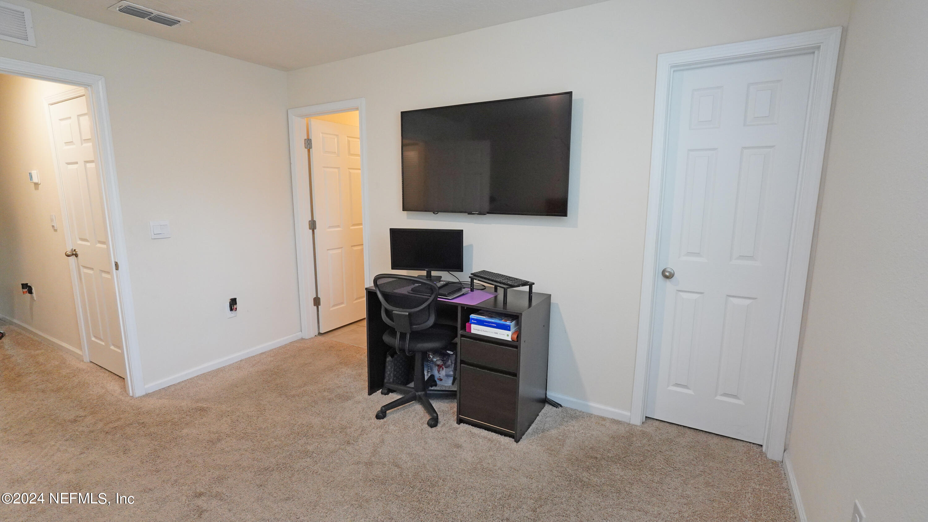 86760 Mainline Road Yulee, FL 32097 - Photo 14 of 17 a view of a workspace with furniture