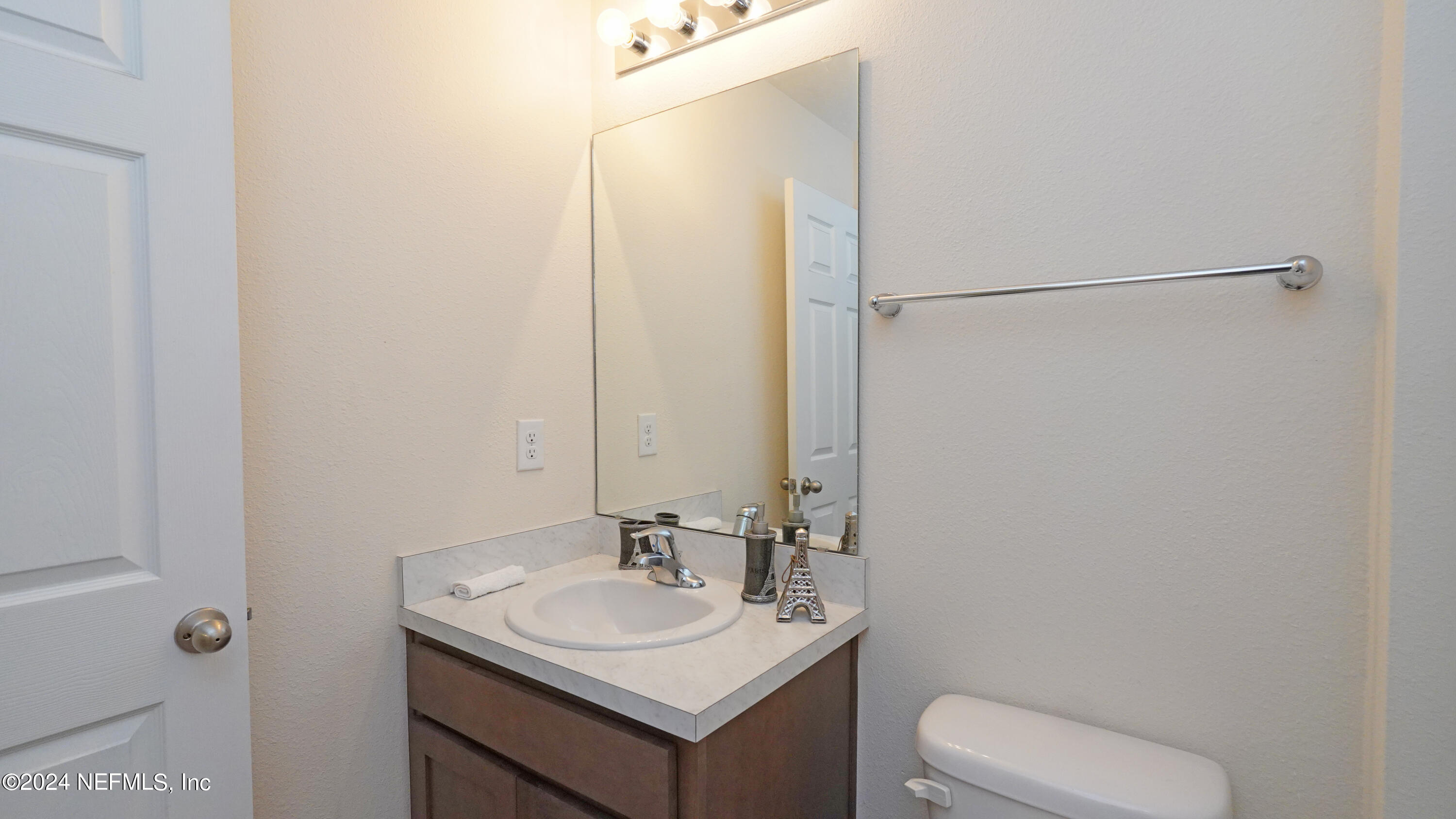 86760 Mainline Road Yulee, FL 32097 - Photo 15 of 17 a bathroom with a sink toilet and a mirror