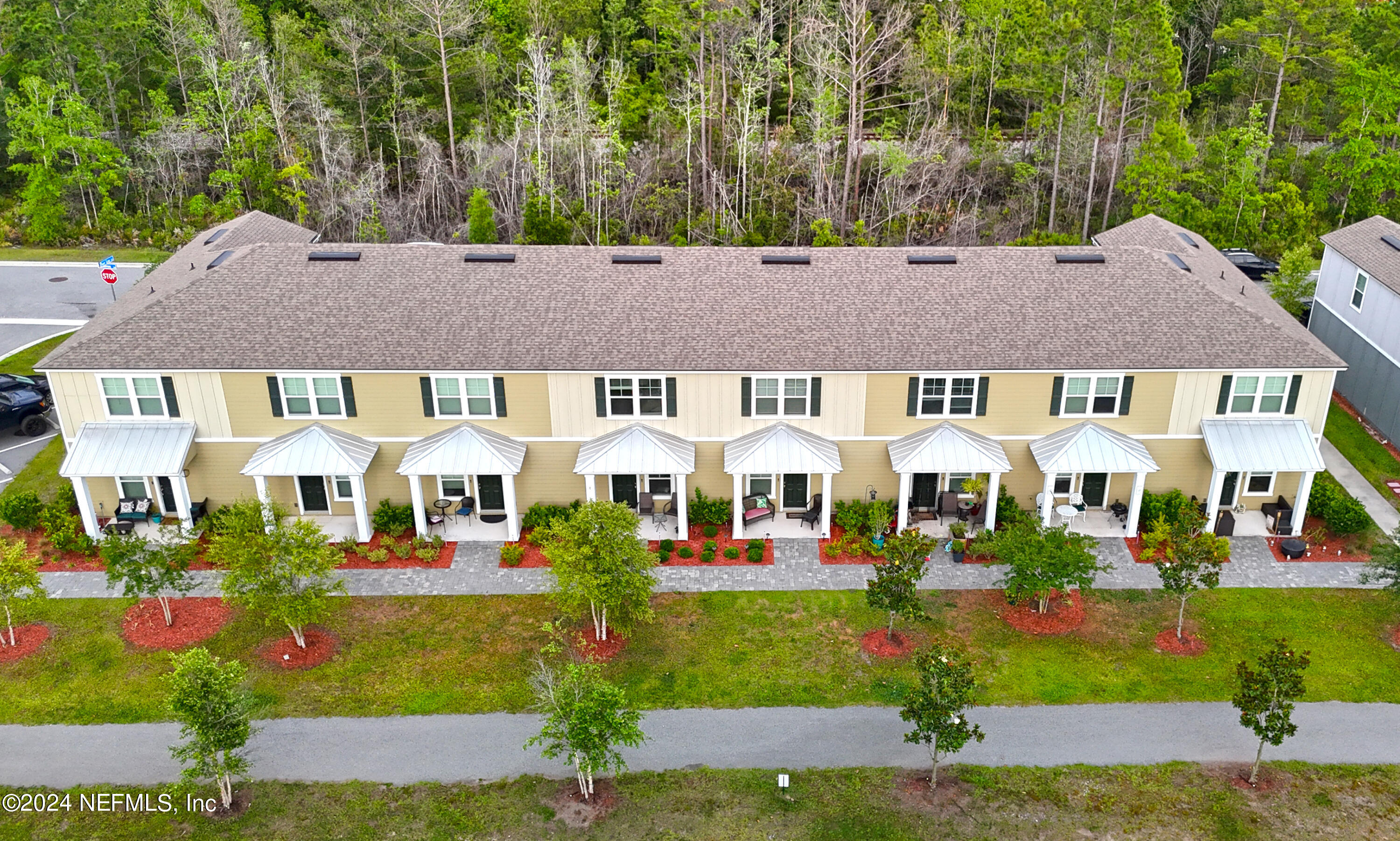 86760 Mainline Road Yulee, FL 32097 - Photo 16 of 17 a front view of a residential houses with yard and green space