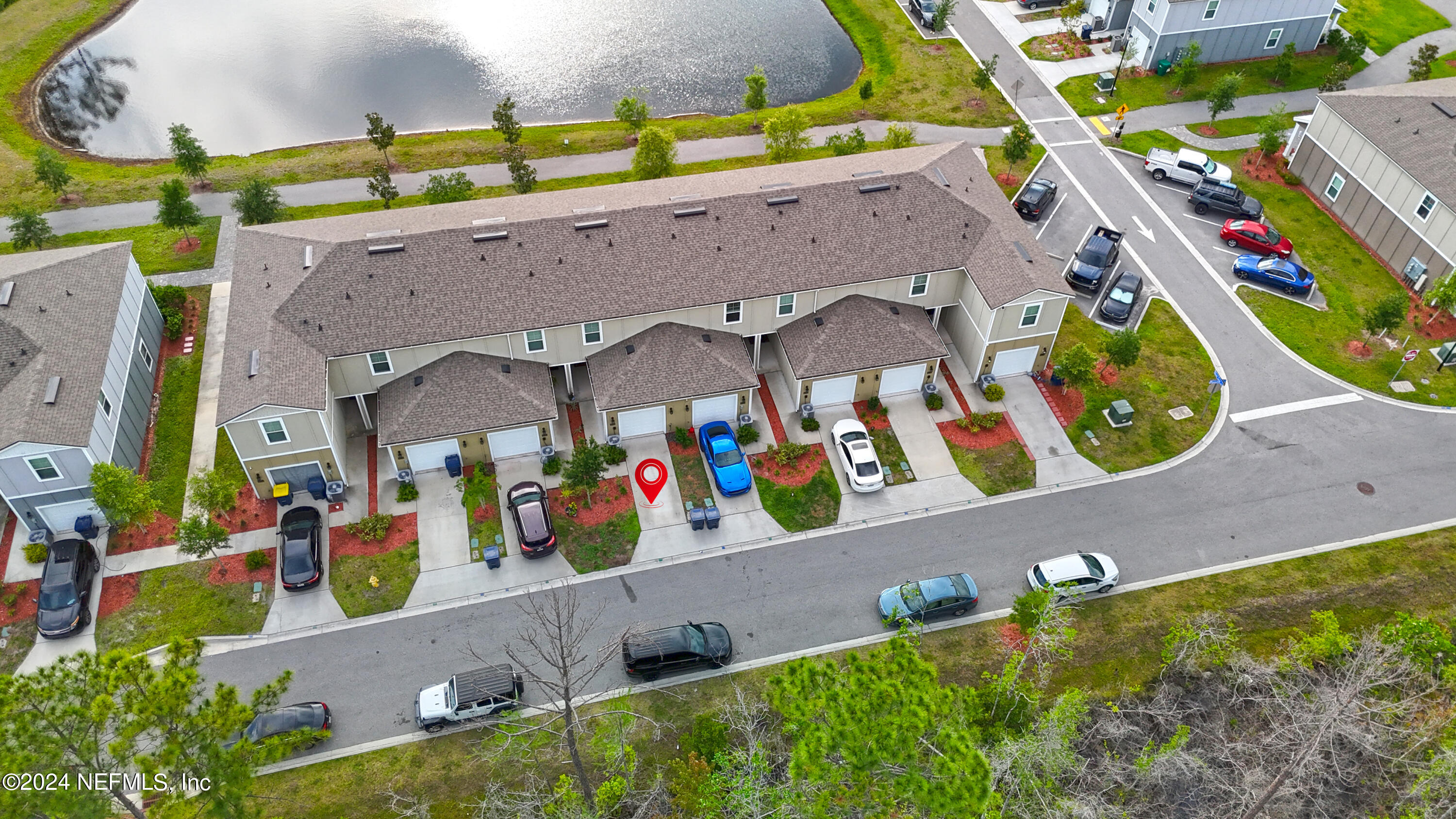 86760 Mainline Road Yulee, FL 32097 - Photo 4 of 17 an aerial view of a house with a yard and potted plants