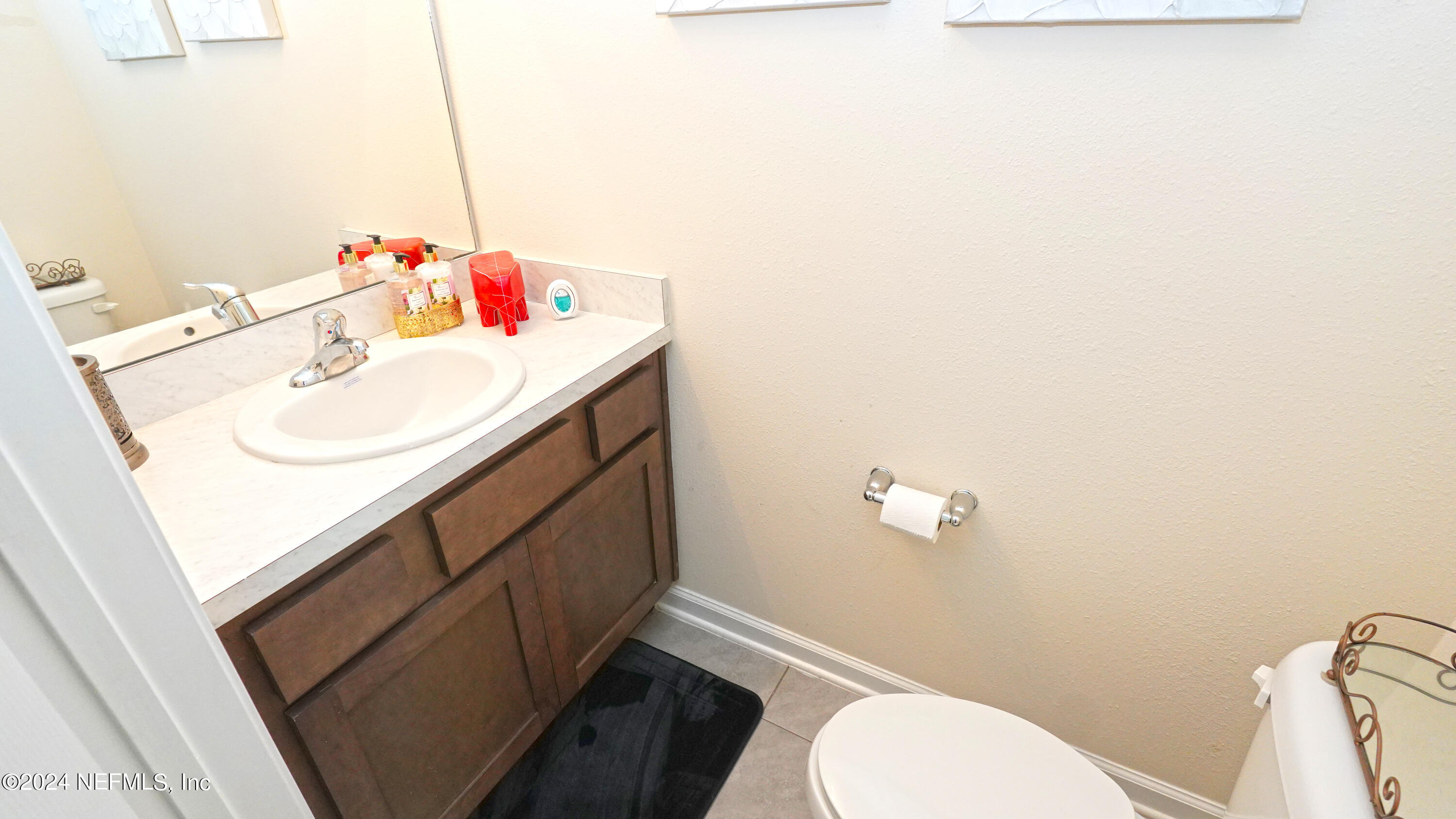 86760 Mainline Road Yulee, FL 32097 - Photo 6 of 17 a bathroom with a sink toilet and vanity