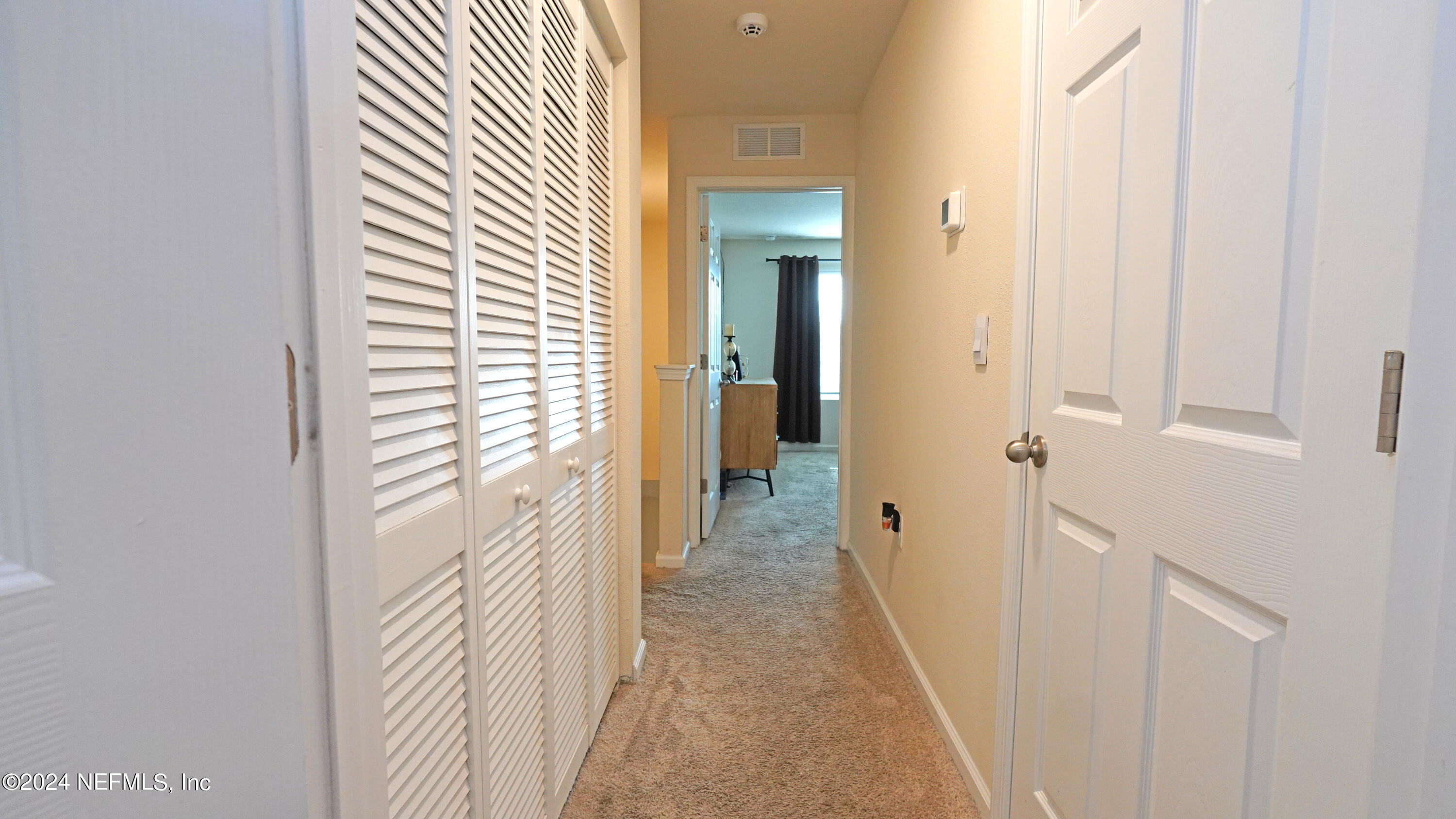 86760 Mainline Road Yulee, FL 32097 - Photo 8 of 17 a view of a hallway with white walls