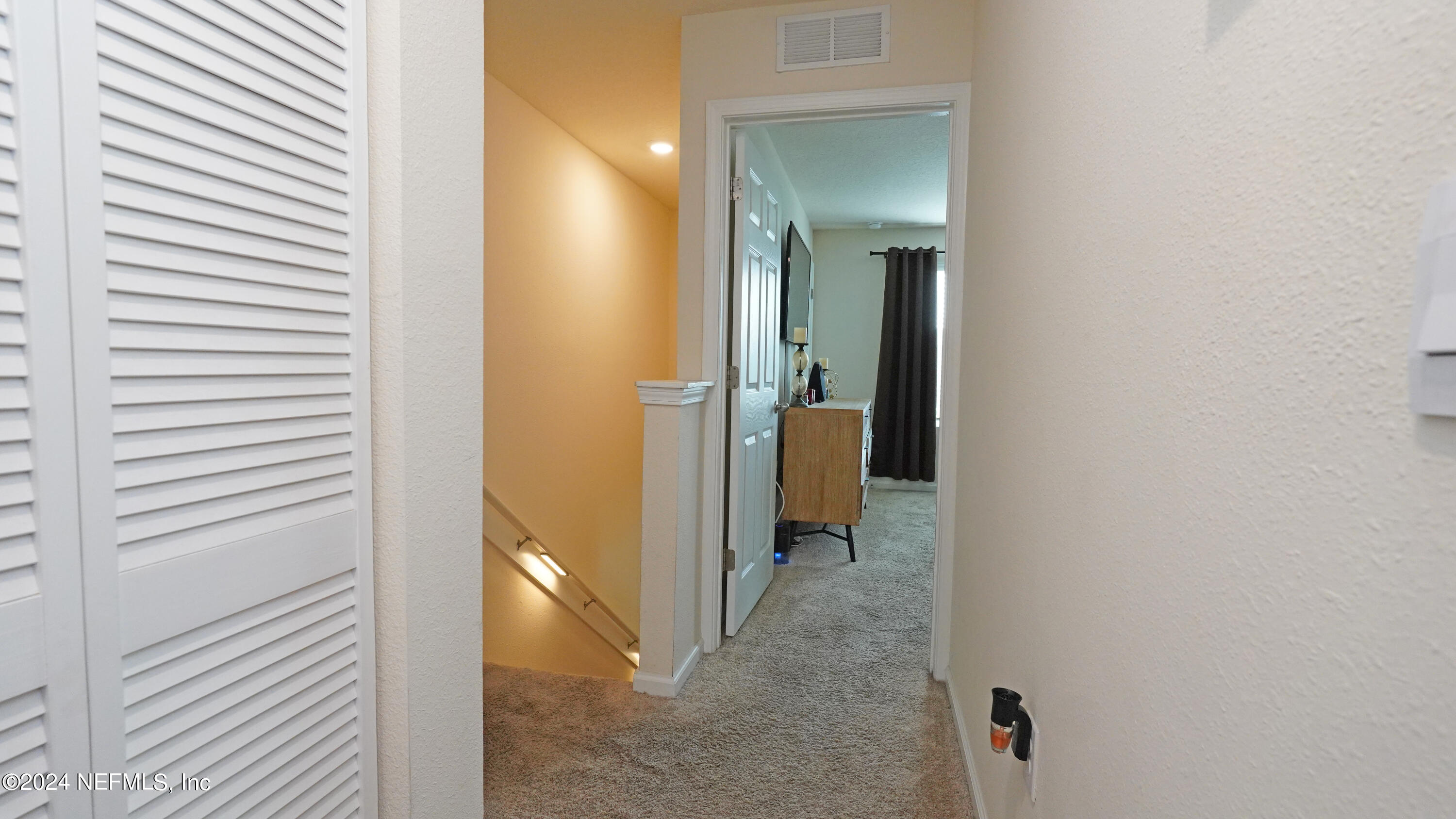 86760 Mainline Road Yulee, FL 32097 - Photo 9 of 17 a view of a bathroom from a hallway