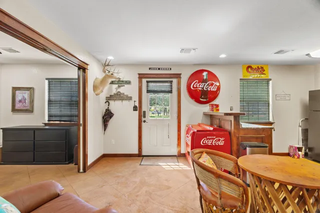 a view of a livingroom with furniture and window