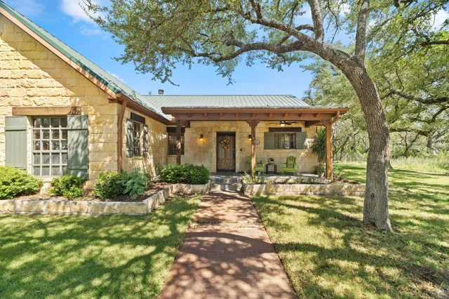 a front view of a house with basket ball court