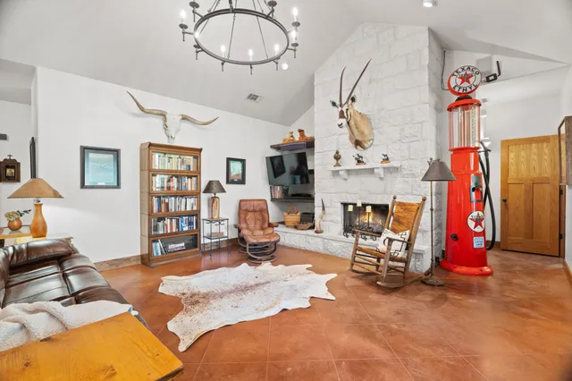 a bedroom with furniture and a chandelier