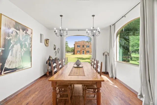 a view of a dining room with furniture window and wooden floor