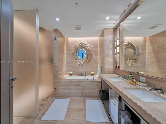 a bathroom with a double vanity sink mirror and shower