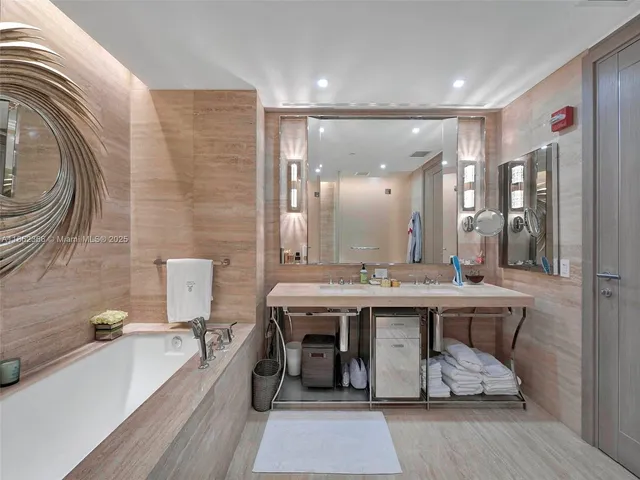 a large bathroom with a sink and mirror