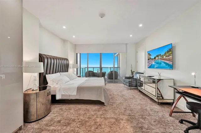 a bed room with a bed and a chair