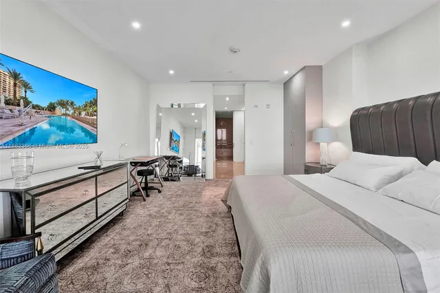 a large room with a bed and furniture