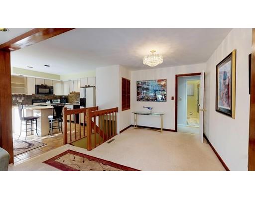 13 Red Barn Road Wayland, MA 01778 - Photo 11 of 19 a living room with stainless steel appliances kitchen island furniture and a chandelier