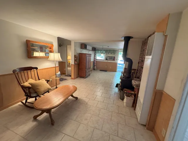 a view of a livingroom with furniture and a flat screen tv