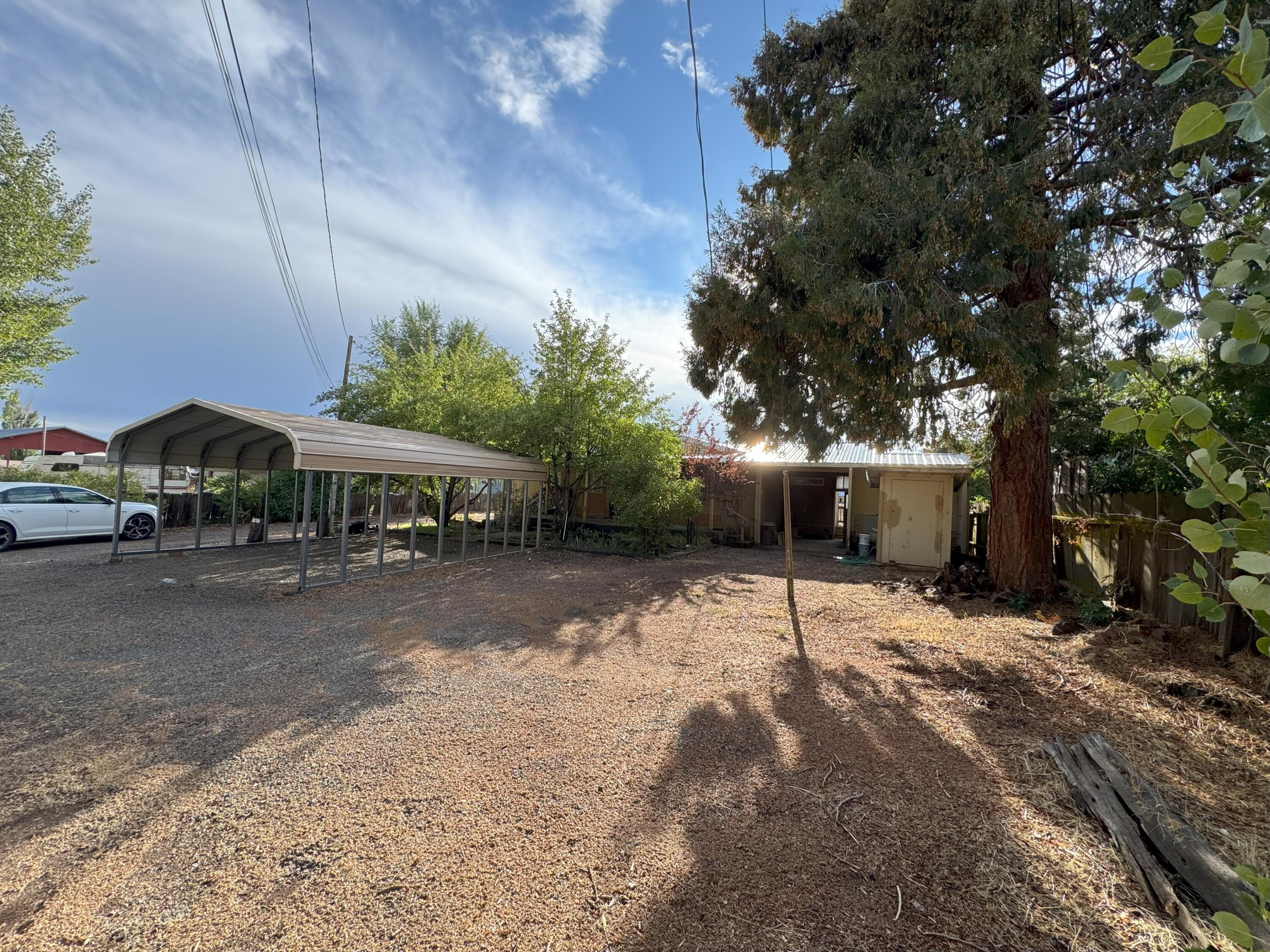 25991 Cir Bell Road Fall River Mills, CA 96028 - Photo 2 of 61 a house with trees in front of it