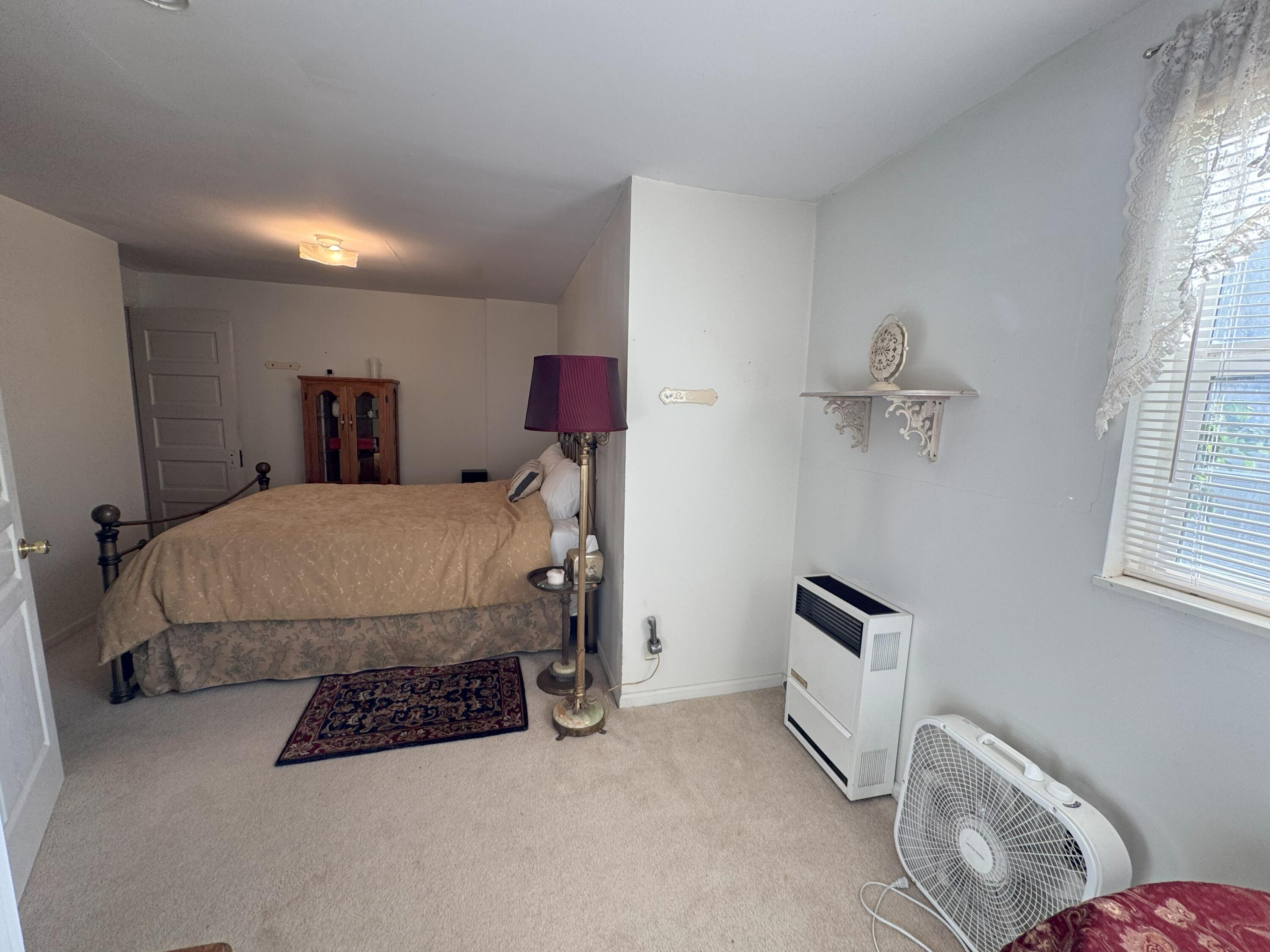 25991 Cir Bell Road Fall River Mills, CA 96028 - Photo 23 of 61 a bedroom with a bed and window
