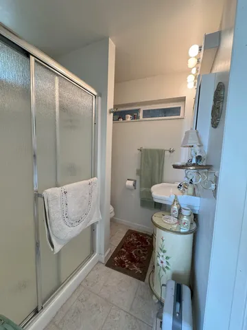 a bedroom with furniture and a window