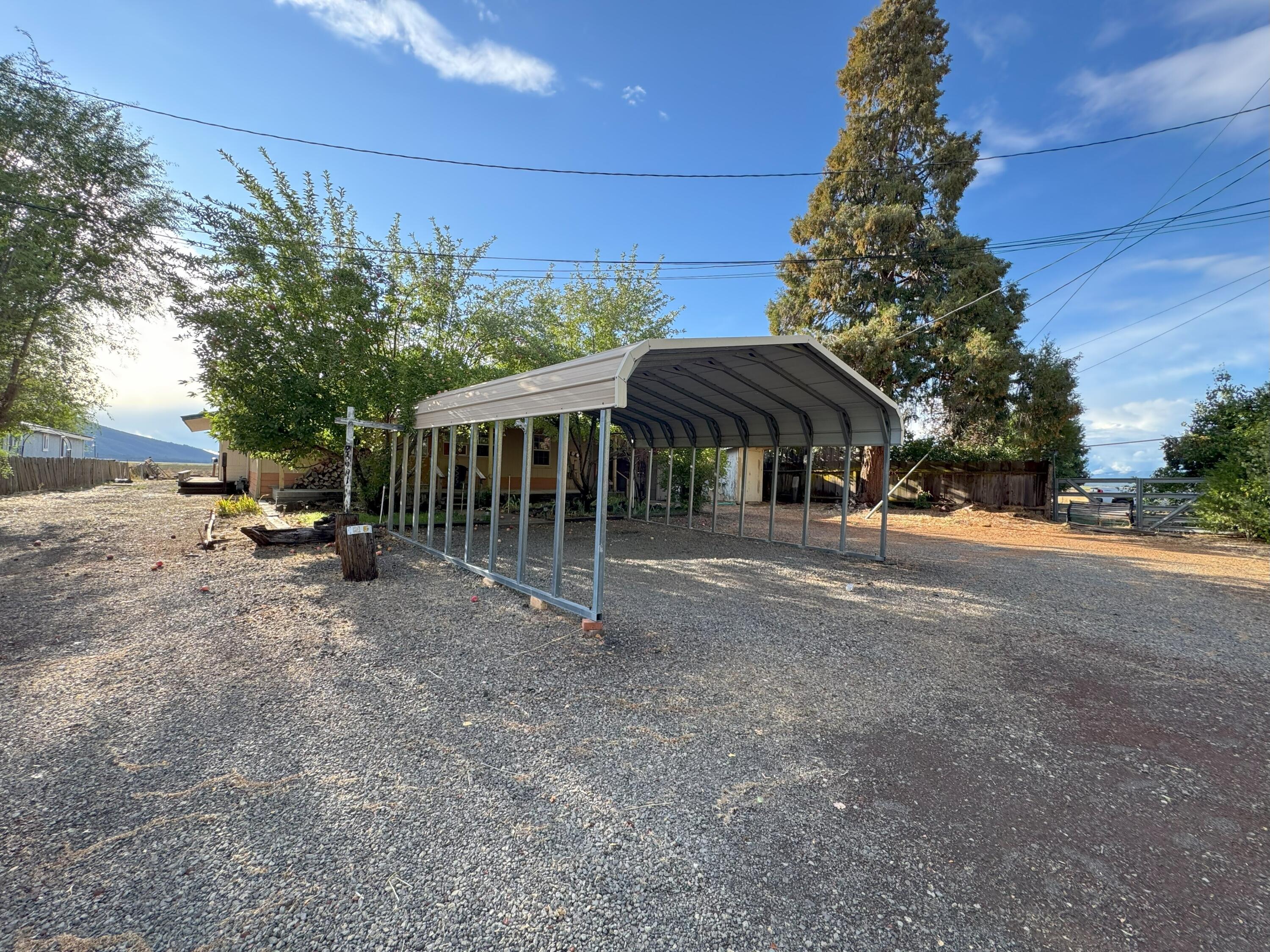25991 Cir Bell Road Fall River Mills, CA 96028 - Photo 3 of 61 a view of a house with a yard