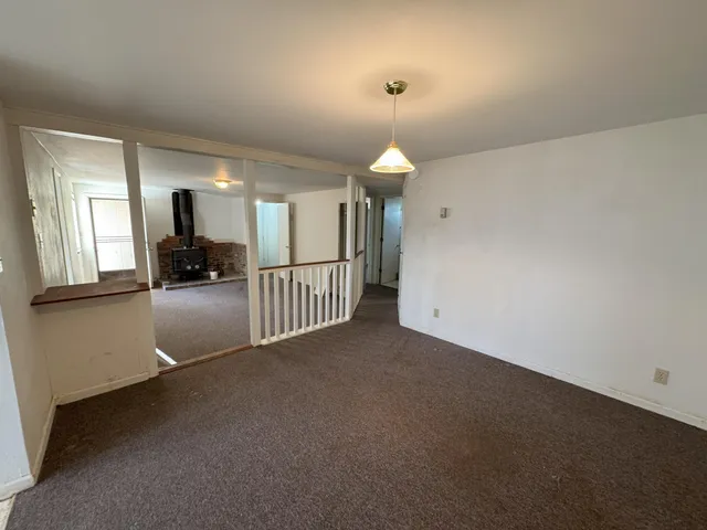 a view of a living room and a wooden floor
