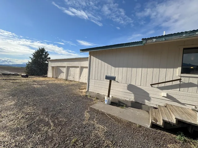 a view of an empty room with windows