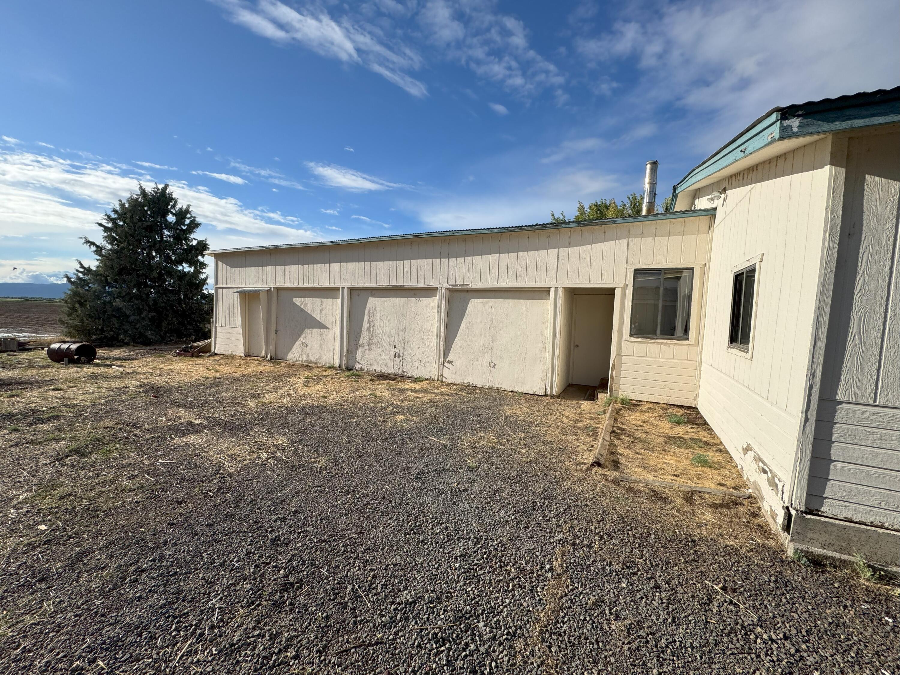 25991 Cir Bell Road Fall River Mills, CA 96028 - Photo 50 of 61 a view of a house with a garage