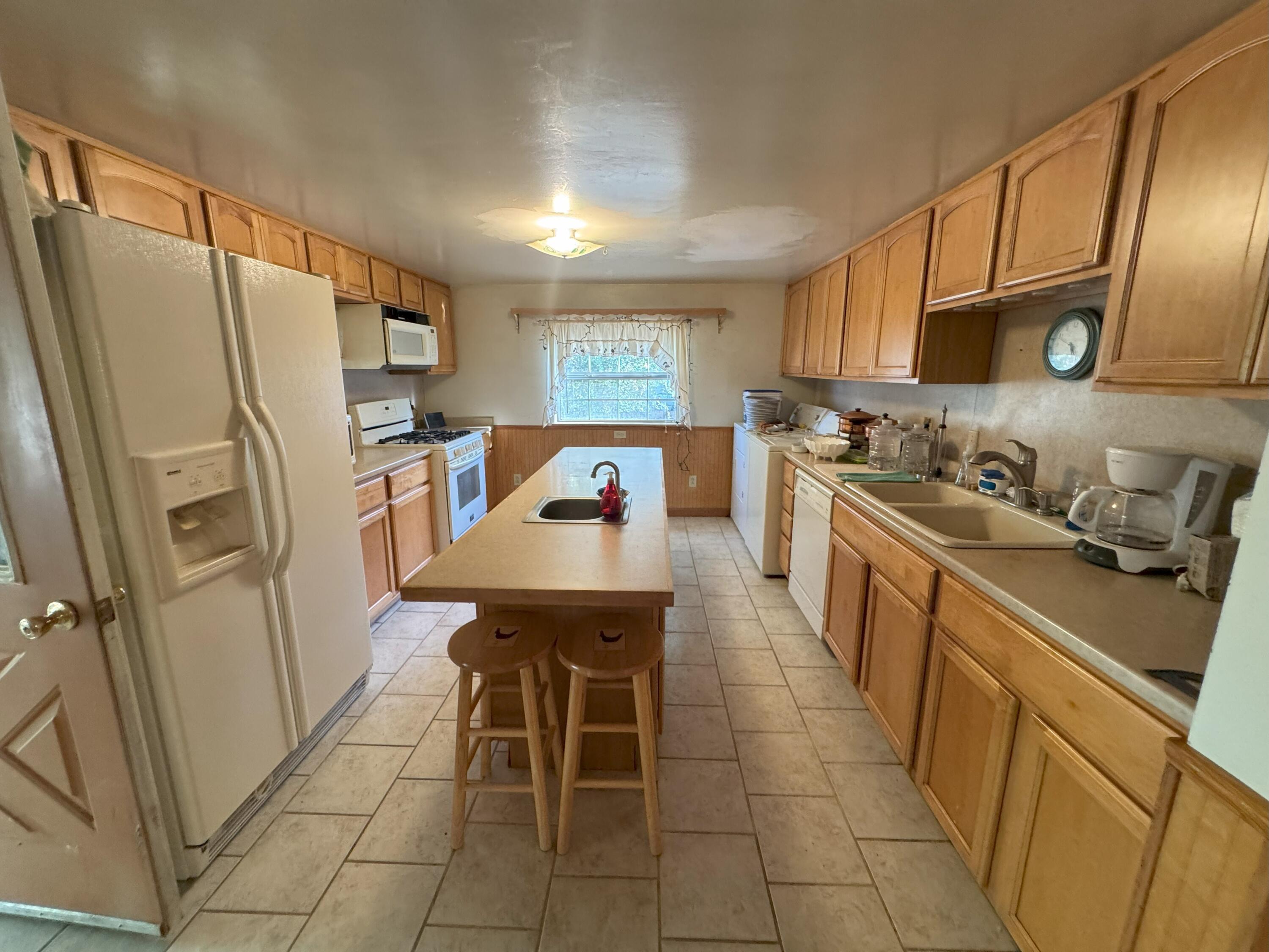 25991 Cir Bell Road Fall River Mills, CA 96028 - Photo 10 of 61 a kitchen with stainless steel appliances a stove refrigerator sink and microwave