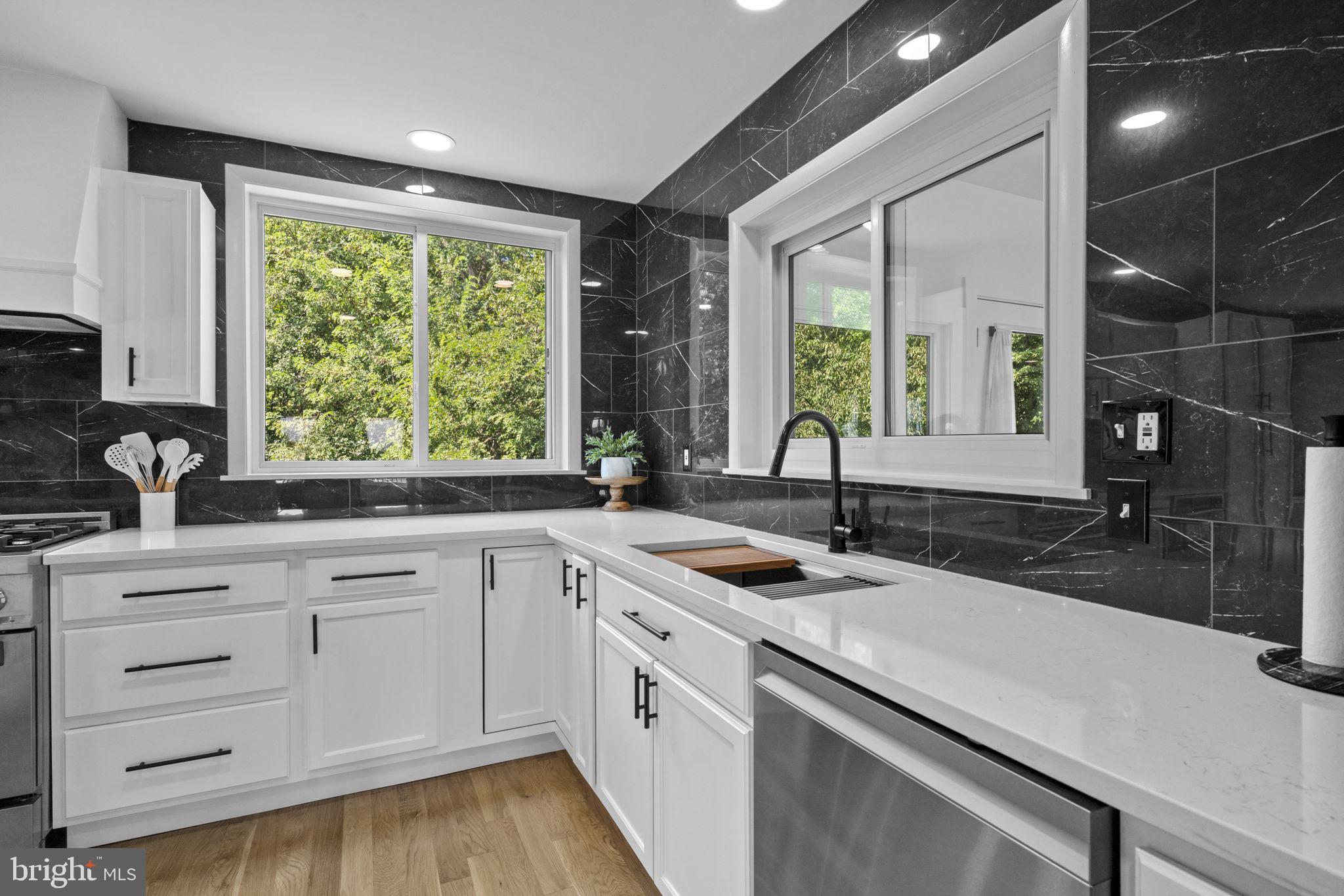 6970 Kim Lane Friendship, MD 20758 - Photo 11 of 50 a kitchen with a sink and large window